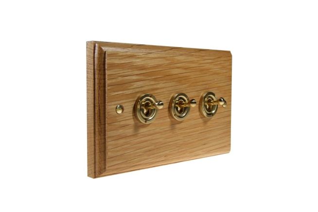 toggle-switch-3gang-2way-polished-brass-light-oak