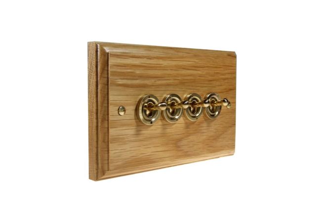 toggle-switch-4gang-2way-polished-brass-light-oak