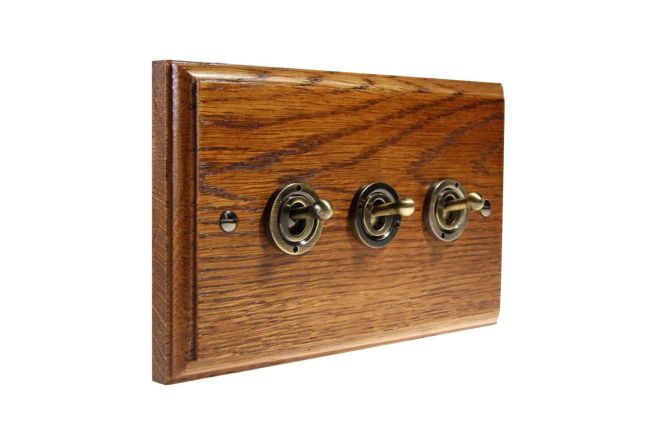 toggle-switch-3gang-2way-antique-brass-medium-oak